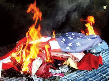 Members of the American Legion burn old flags and replace them with new ones in observance of Flag Day, on June 14. Burning flags is the proper way to dispose of them.