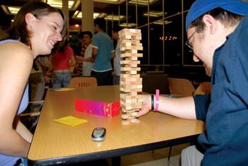 [left to right] Jessica Golebiowski, anthropology senior and Sean Richardson, psychology and sociology junior play jenga Friday night at Late Night in the LSU union.