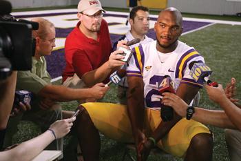 unior quarterback JaMarcus Russell is surrounded by the press during LSU's annual media day Aug. 13. Despite a 14-2 record as a starter, LSU coach Les Miles has yet to publicly name Russell the team's starter for the upcoming season.