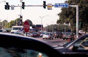 Turning cars rush out of traffic jams around the corner of S. Stadium Dr. and Nicholson Dr. during the power outage Wednesday afternoon in the midst of rush hour.