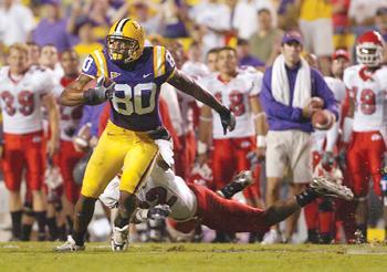 LSU receiver Dwayne Bowe breaks away from Fresno State's Damon Jenkins during the second quarter of the Tigers' 38-6 win Saturday night in Tiger Stadium.