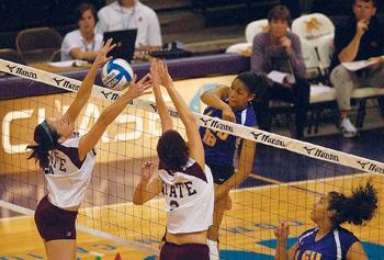 Senior middle blocker Melody Clark hits a ball over the net Oct. 1 against Mississippi State University. Clark and sophomore outside hitter Marina Skender led the Tigers with three blocks each in LSU's loss against Florida on Sunday.