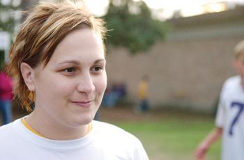 Robyn DesOrmeaux smiles while watching friends tailgate Saturday before the Alabama football game. DesOrmeaux said the support of her friends and former teammates helped her battle cancer. DesOrmeaux's cancer is in remission.