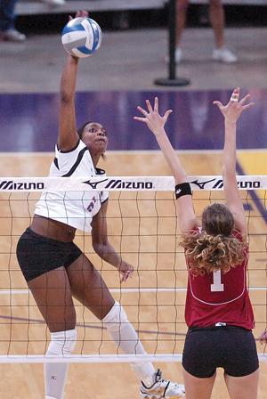 Junior right side hitter Vanessa Freeman hits the ball past Arkansas outside hitter Denitza Koleva on Wednesday in LSU's three-game win over the Lady'Backs in the PMAC. Freeman had 10 kills in the match.