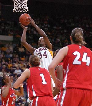 LSU junior center Sylvia Fowles shoots the ball over University of Georgia defenders Jan. 7 during the first half of the Lady Tigers' 57-55 win.