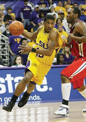 Sophomore guard Terry Martin drives to the basket Jan. 17 past Ole Miss forward Kenny Williams in the Tigers' 62-55 win over the Rebels in the PMAC. The Tigers take on the University of Alabama tonight at 8 p.m. in the PMAC.