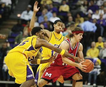 LSU senior forward Darnell Lazare and sophomore guard Garrett Temple double-team Ole Miss guard Todd Abernethy Wednesday night during the Tigers' 62-55 win over the Rebels in the PMAC. LSU plays Arkansas in Fayetteville on Saturday.