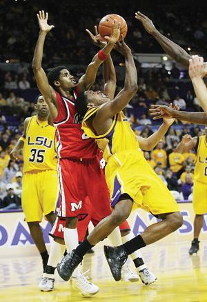 LSU sophomore guard Tasmin Mitchell shoots the ball Wednesday night against Ole Miss guard Bam Doyne in the second half of the Tiger's win 62-55 over the Rebels in the PMAC. Mitchell finished the game with 19 points and 10 rebounds.