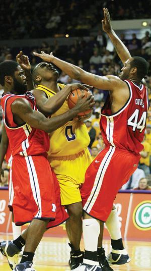 LSU junior forward Glen Davis gets double-teamed by Ole Miss forward Kenny Williams (left) and center Dwayne Curtis (44) on Wednesday in the Tigers' 62-55 win in the PMAC. LSU lost on the road Saturday to the University of Arkansas.