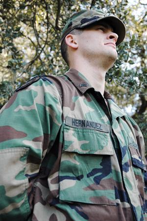 Sociology junior David Hernandez demonstrates the new uniform being phased into the armed forces.