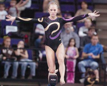 LSU senior gymnast Kelly Phelan performs on beam Friday night in the PMAC as the gymnastics team defeated the University of Arkansas Gym'Backs. Phelan won first place in the all-around category.