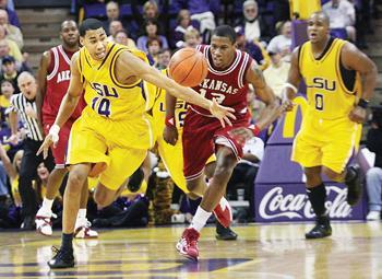 LSU sophomore Garrett Temple steals the ball Saturday in the Tigers' 71-67 win over the University of Arkansas in the PMAC. Temple's dunk after the steal gave LSU a five-point lead with 29 seconds left to play.