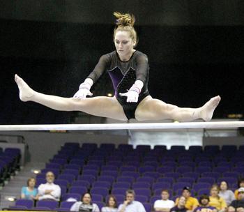 LSU gymnast Nicki Butler focuses on the bar March 16 in her uneven bars performance against the University of Nebraska. The Tigers did not win the match, but will attempt to end the season in a successful manner Friday against Centenary.