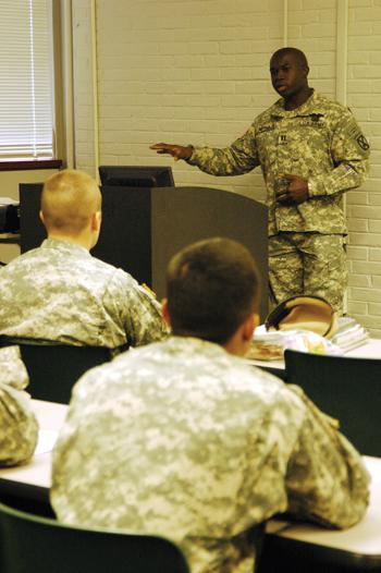 Captain William Reynolds III tells his story to senior cadets Tuesday morning. Reynolds was injured by a IED in Iraq while serving in the military.