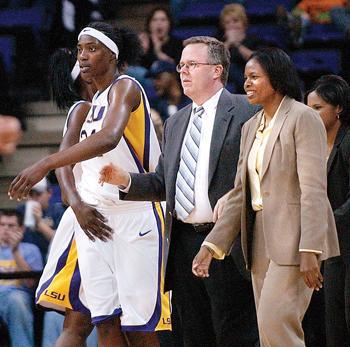 <p>Carla Berry, former women's basketball assistant coach, stands with interim head coach Bob Starkey and Sylvia Fowles. Berry announced her resignation from the team Friday.</p>