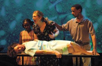 Glenn Aucoin, theater freshman, and MFA candidates Kesha Bullard, Nikki Travis, and Reuben Mitchell prepare for the opening of "Cocktail." The show will run April 18-May 6 at the Swine Palace.