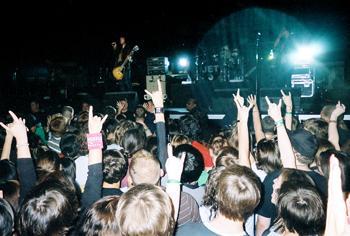 A thick crowd of people cheer for Jet during their performance during X-Fest at the River Center on Saturday night. The indoor festival also featured AFI, Papa Roach, Red Jumpsuit Apparatus and The Killers.