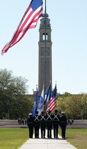 Color guard members stand at attention Thursday during the Chancellor's Day Parade on the Parade Grounds.