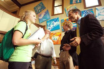 Jaime Kolz, mass communication sophomore, talks with Steve Kelley, Times-Picayune editorial cartoonist during a lecture Thursday in the Journalism Building.