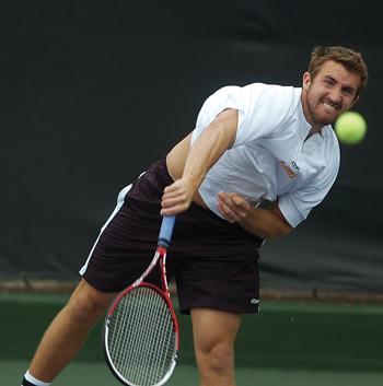 Senior Kevin Dessauer serves during a Feb. 20 doubles match against Rice University. Dessauer advanced to the Single A Bracket finals this past weekend but fell in three sets to Southern Methodist's David Kuczer.