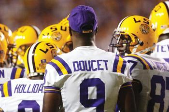 LSU senior wide receiver Early Doucet watches Saturday as LSU takes on then-No. 9 Florida. LSU coach Les Miles said Doucet is expected to dress for the Kentucky game.