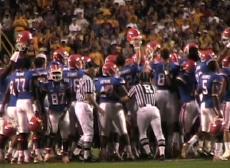 Members of the Florida football team stomp on LSU's midfield logo before Saturday's game against the Tigers.