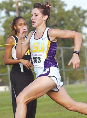 Former runner Rachael Graham competes in a cross-country meet this past season.