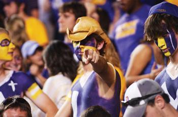 An LSU fan sitting Saturday in the student section in Tiger Stadium points toward the field during the first half of the Tigers' game against Auburn. Gillette Power Fusion is holding a contest to see which college has the best "game face."