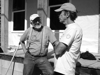 "Breach of Faith" author Jed Horne chats with CrossRoads Mission volunteer Chuck McCoy on Saturday in New Orleans. The Honors College sent volunteers to New Orleans and St. Bernard on Saturday to help with Hurricane Katrina recovery efforts.