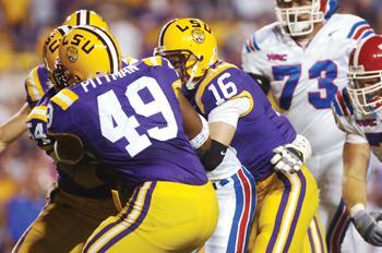 Senior safety Craig Steltz helps to make a tackle in LSU's game against Louisiana Tech on Saturday. Steltz's hard-hitting, no mercy style of defense can be compared to Adam Sandler's character Bobby Boucher.