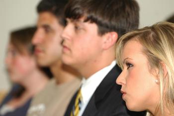 SG senator Kristen Oaks and SG director of athletics Dixon McMakin listen intently Monday during the SG election forum.