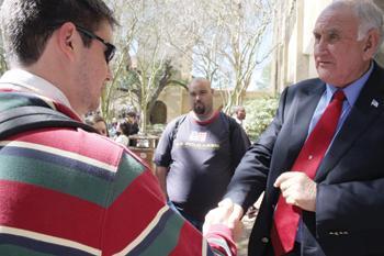 Josh Anderson talks Wednesday with Dr. William Jenkins, acting chancellor, in front of Middleton Library. Dr. William L. Jenkins assumed duties as Acting Chancellor on February 1, 2008.