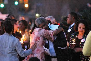 Family members of the two students murdered Friday at Louisiana Technical College comfort each other Sunday at a memorial held for the dead students.