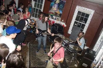 Man Plus Building plays for a crowd of fans Feb. 21 at a house show on State Street. Events like this one are gaining popularity in Baton Rouge.