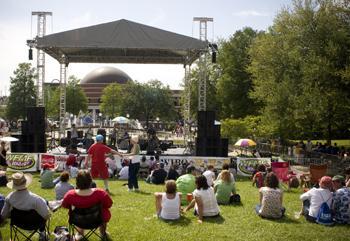 Festival attendees enjoy the music of the Iguanas on Sunday afternoon downtown on the grounds of the Old State Capitol.