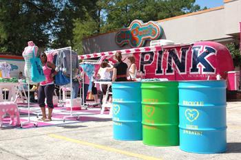 Victoria's Secret representatives stand before Mr. Gatti's Pizza on Tuesday promoting their "Recycle Your Sweats" campaign. LSU was the first stop for this year's tour.