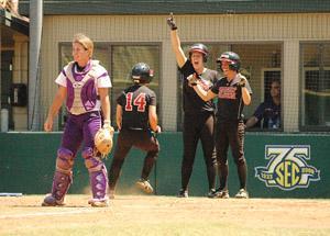 UL-Lafayette sophomore designated player Vallie Gaspard (14) crosses home plate during the Ragin' Cajuns 6-3 NCAA Regional win Sunday against LSU.