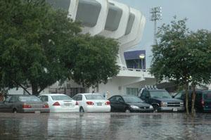 Cars in the parking lot near the Maddox Field House sit in more than a foot of water.