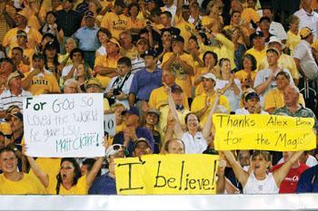 LSU fance celebrate after the Tigers' win June 9 against UC Irvine. The win secured the Tigers' spot in the College World Series.