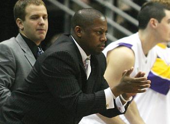 Former LSU assistant basketball coach Chad Dollar cheers on his team during a game.