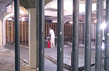 A construction worker sprays the concrete in the Union.