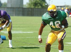 LSU linebacker Darry Beckwith runs a drill at fall camp. Beckwith is the veteran leader of the linebacker corps.