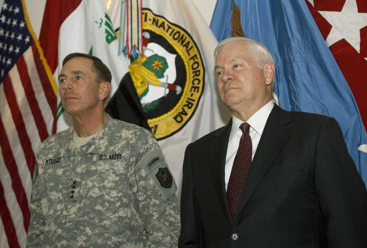 U.S. Commanding General of Multinational Forces in Iraq, David Petraeus, left, and U.S. Secretary of Defense Robert Gates stand during a ceremony in which Gates recognized Petraeus and US Ambassador Ryan Crocker for distinguished service Monday, Sept. 15, 2008 on the outskirts of Baghdad.