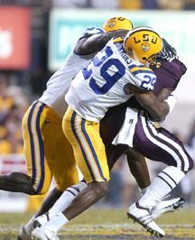 LSU safety Chris Hawkins brings down a Mississippi State player Saturday night during the Tigers' 34-24 win against the Bulldogs.