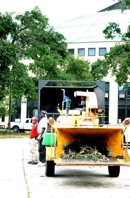 A wood chipper sits near the Parker Coliseum awaiting trees to break into mulch.