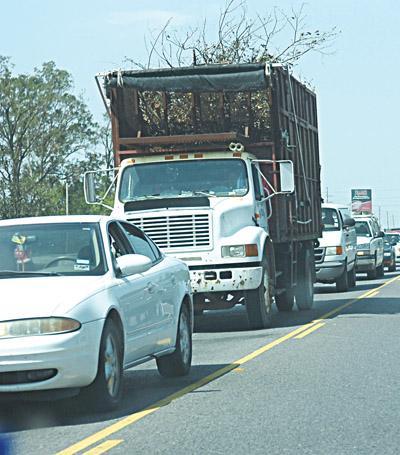 Traffic slows to a standstill along Nicholson Drive near Brightside Drive. Nicholson Drive will soon be widened to make room for turning lanes.