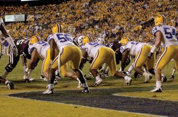 The Tigers&#8217; defensive line holds the Bulldogs&#8217; at the 1-yard line during LSU&#8217;s 34-24 victory Saturday against Mississippi State in Tiger Stadium.