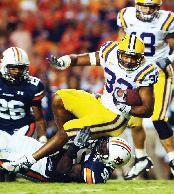 LSU junior running back Charles Scott dives forward for a first down Sept. 20 against Auburn. LSU defeated Auburn, 26-20, in Jordan-Hare Stadium in Auburn, Ala. The Tigers, whose scoring margins are the highest in the first and third quarters, have a negative scoring margin in the fourth quarter of games this season.