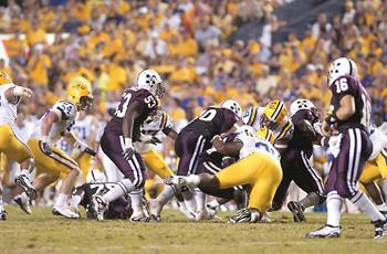 Senior defensive end Charles Alexander makes a tackle Saturday night in Tiger Stadium during the Tigers&#8217; 34-24 win against Mississippi State.