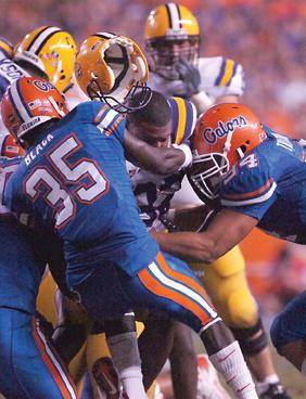 Florida's defense swarms LSU running back Charles Scott during the Tigers' 51-21 loss to the Gators on Saturday.